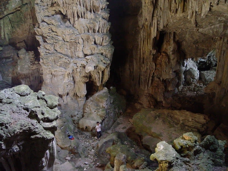 Cueva del Agua near Jalpan de Serra with stalactites and stalagmites inside a cave filled with a subterranean pool