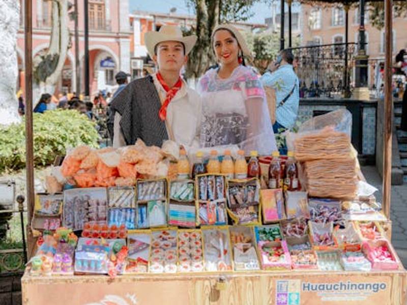 A variety of regional Mexican drinks displayed at a traditional Mexican market