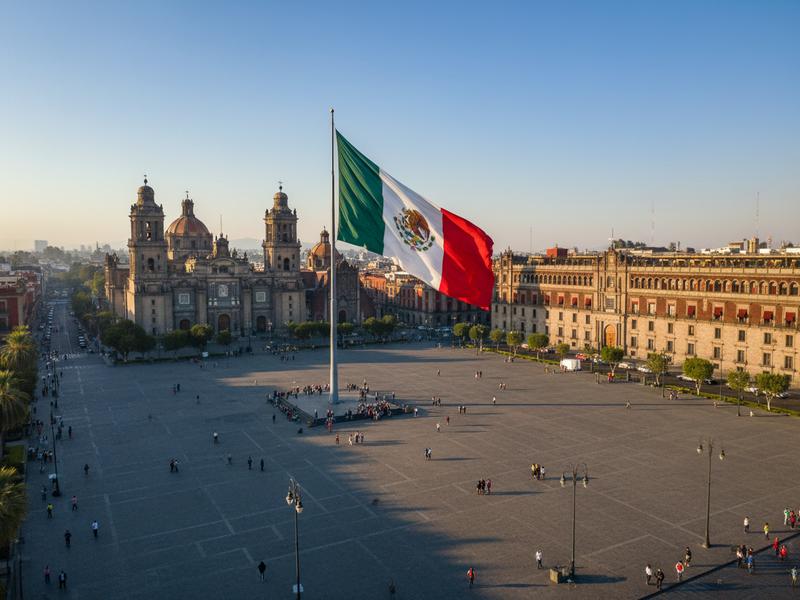 Mexico City's historic center Zócalo with the Palacio Nacional murals by Diego Rivera and the Metropolitan Cathedral