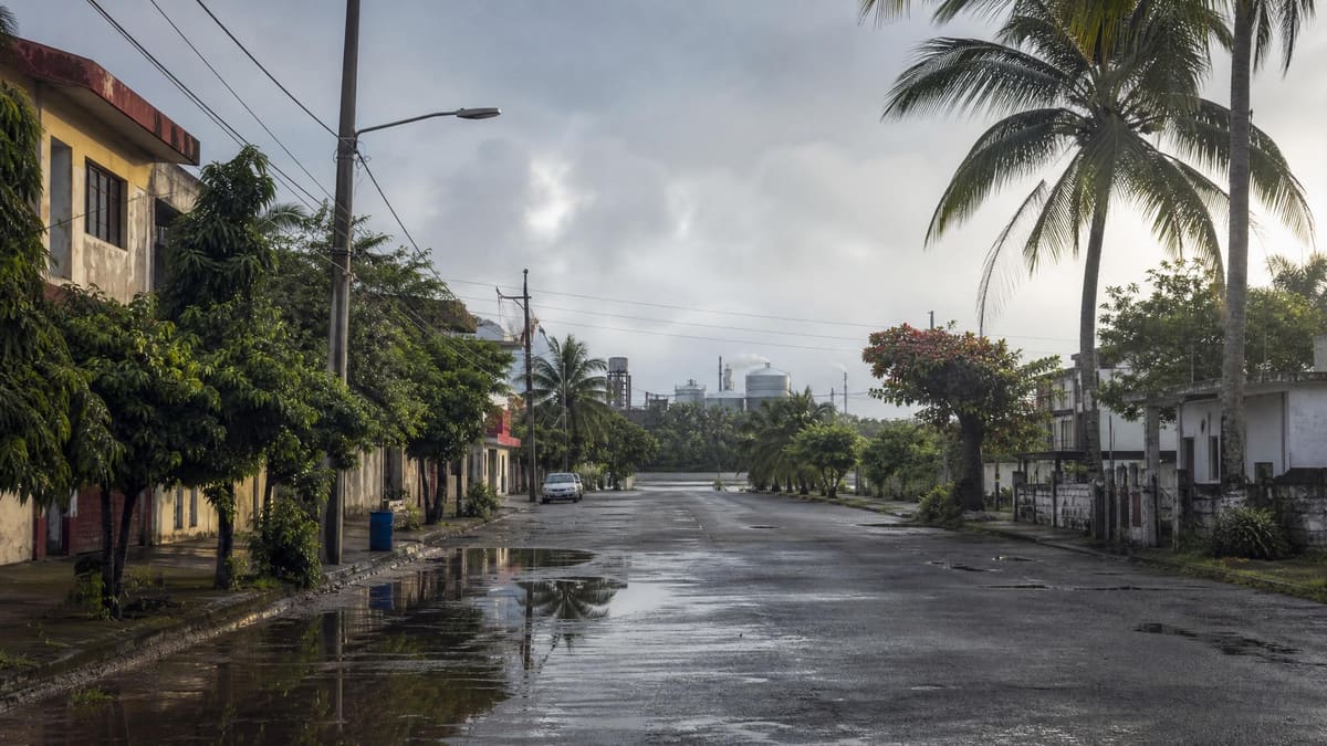 Wet Minatitlan street after early rainy-season showers in southern Veracruz