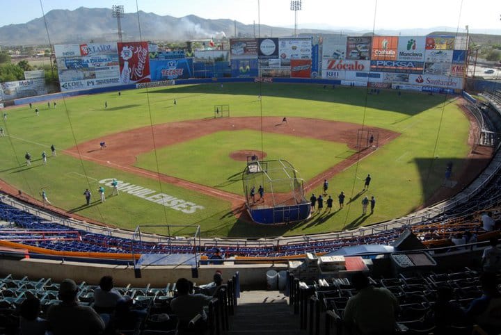 Estadio Borregos — home of Acereros de Monclova, Mexican Baseball League team, with covered grandstands and industrial city backdrop