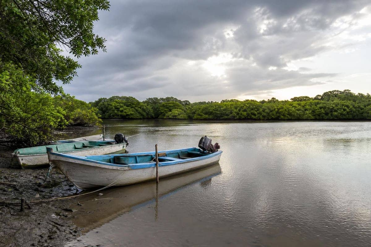 Fishing boats near Mecoacán Lagoon by Paraíso, Tabasco under clearing October rain clouds