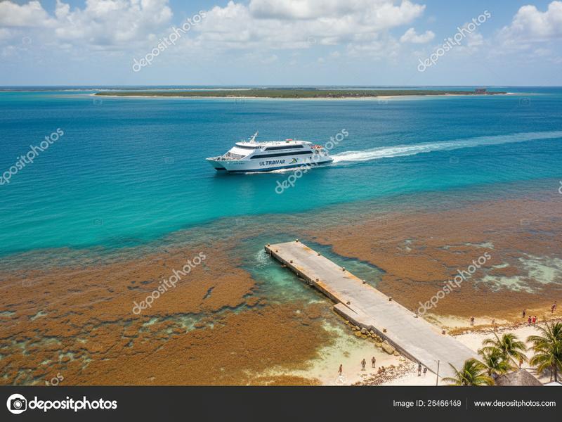 Ferry leaving Playa del Carmen toward Cozumel on blue Caribbean water