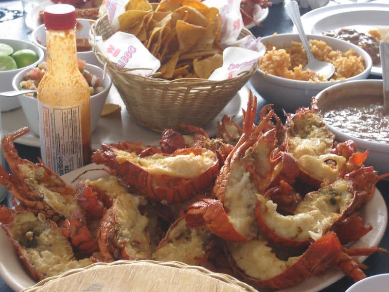 Puerto Nuevo-style lobster served with beans, rice, and flour tortillas in Baja California