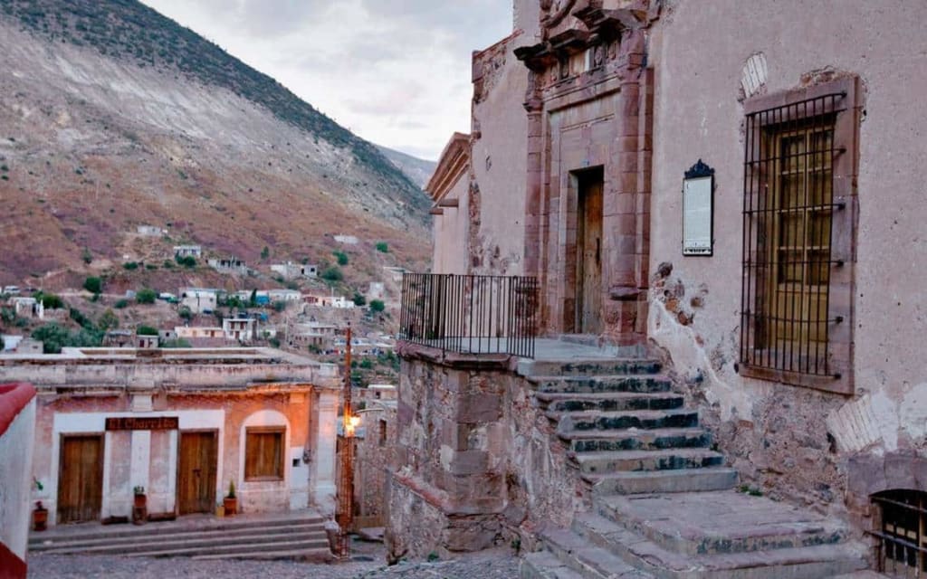 Real de Catorce cobblestone street — narrow alley lined with restored colonial buildings in the Chihuahuan Desert