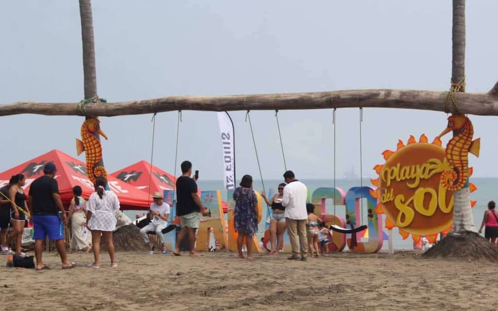 Playa Paraíso beach near Villahermosa Tabasco with palm trees and calm Gulf of Mexico water at sunset
