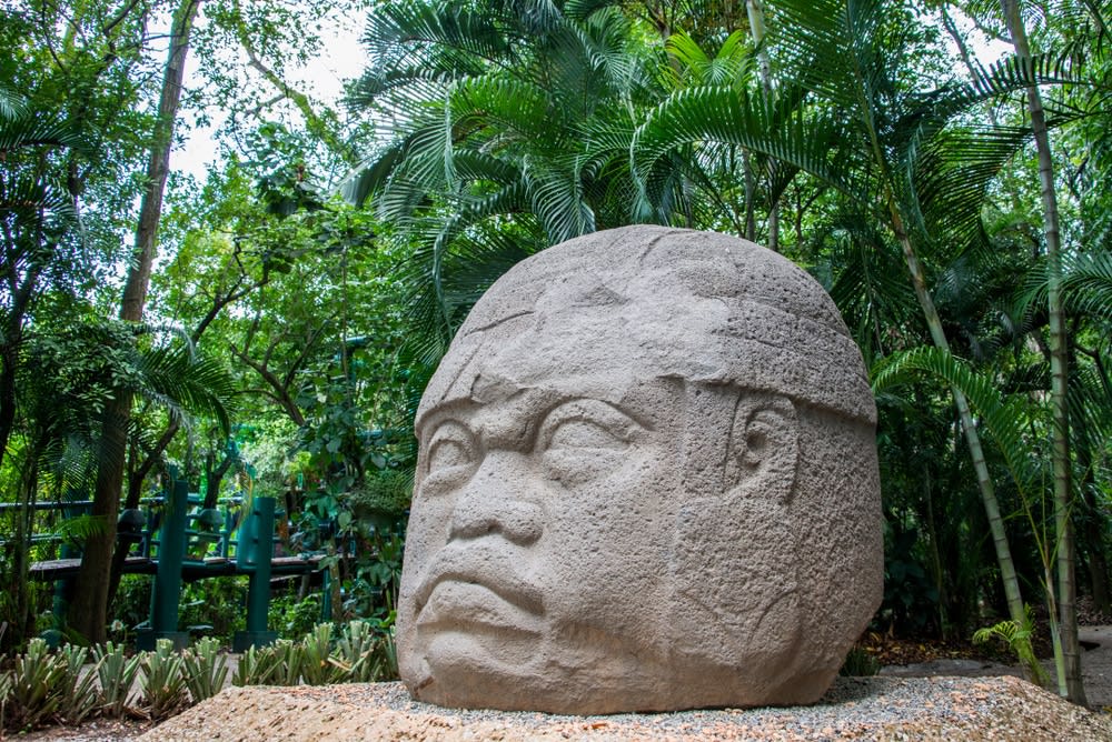Pre-Hispanic Olmec colossal head sculpture in Carlos Pellicer Museum Villahermosa — basalt carving showing ruler's face