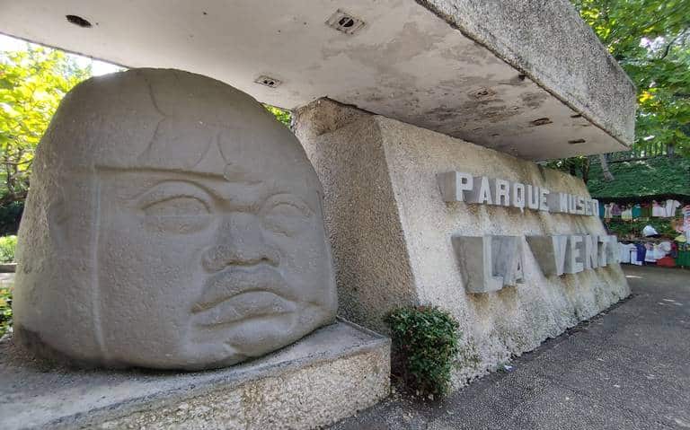 Giant Olmec stone colossal head at Parque-Museo La Venta in Villahermosa, Tabasco — basalt sculpture weighing 20+ tons