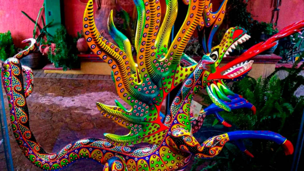 Brightly painted Mexican alebrijes in multiple colors — fantastical hybrid animal folk art creatures from Oaxaca
