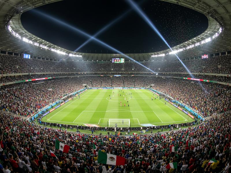 Inside Estadio Azteca showing the massive green pitch and packed stands