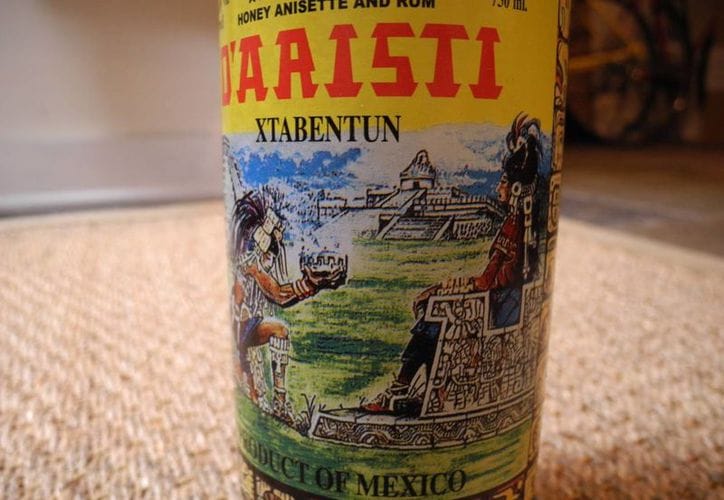 Close-up of an Xtabentún bottle label with Mayan artwork